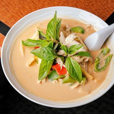 Panang Curry, in coconut milk, with zucchini, bell peppers, and Thai kaffir lime leaves.