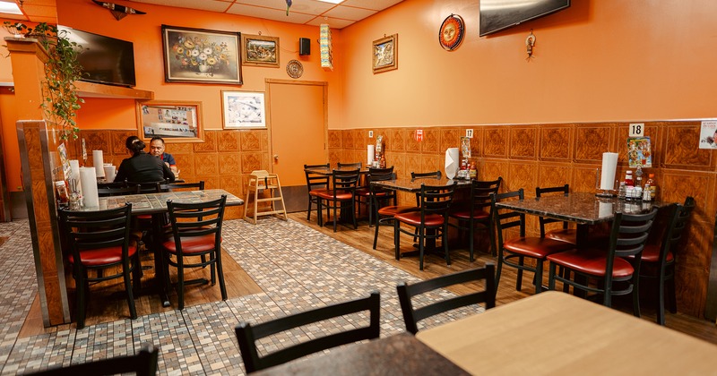 Interior space, dining area, two guests enjoy their food