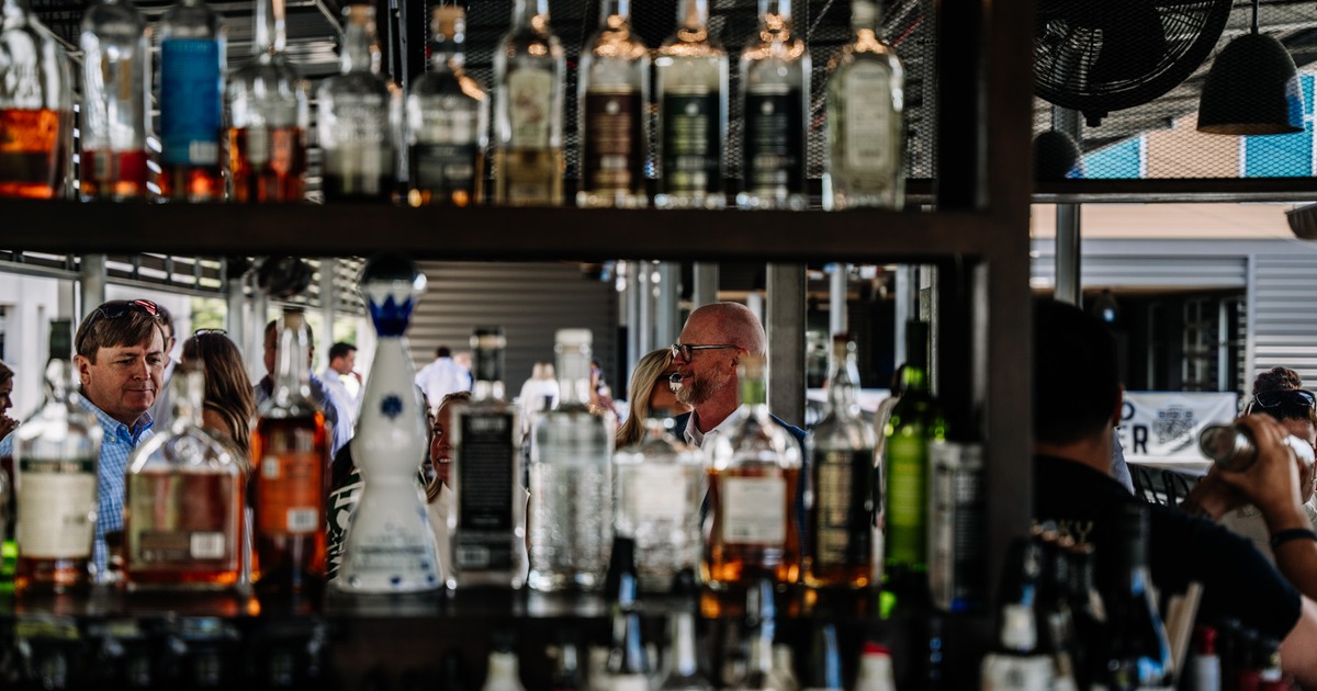 Shelves stocked with liquor bottles