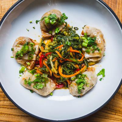 Venison and boar dumplings served with Bok choy kimchi.