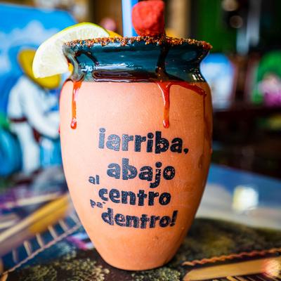 Cantarito cocktail in a clay cup.