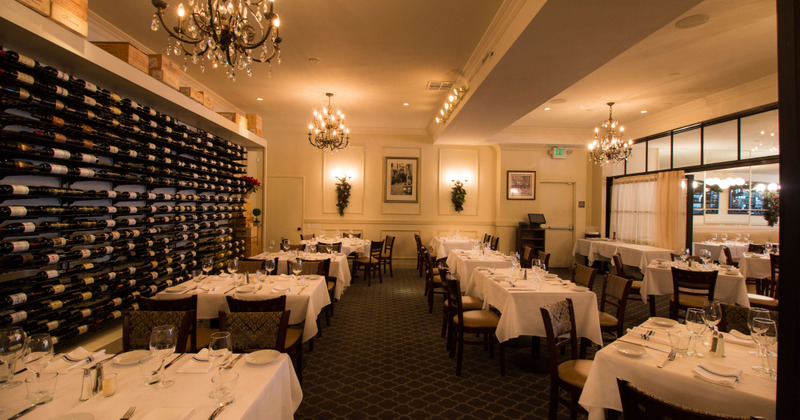 Interior, set dining area with wine racks