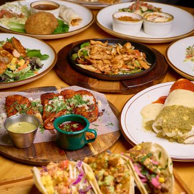 Various Mexican dishes on a table.