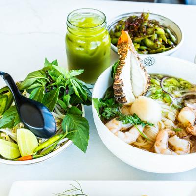 Multiple food plates and Matcha tea