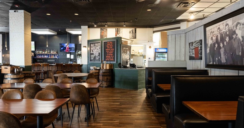 Interior seating area with double booths, chairs and tables