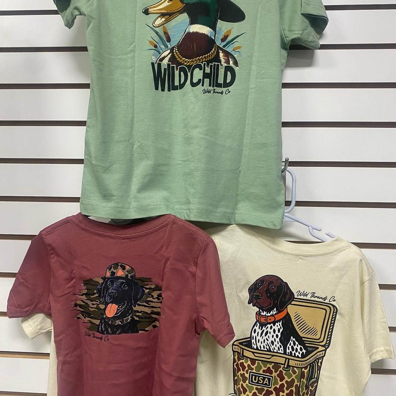 Selection of cotton graphic t-shirts hanging on the wall.