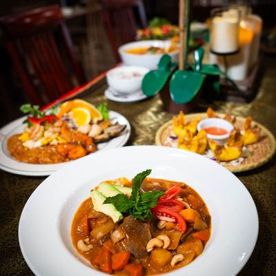 Assortment of food dishes and drinks.