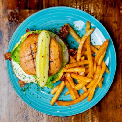 Hangover Burger with French fries, top view.