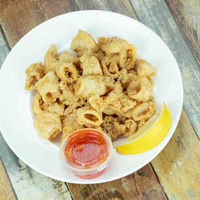 Crispy calamari served with lemon and dipping sauce.