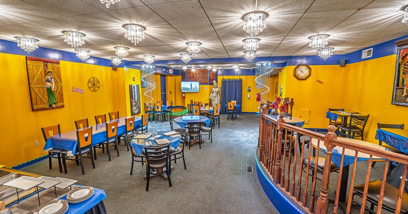 Spacious, colorful and cozy restaurant interior space in Indian style