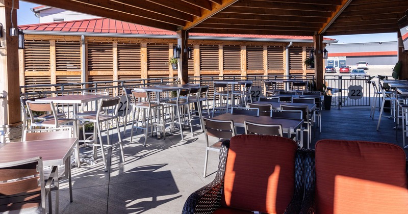 Exterior, patio, covered seating area, low metal railing and gate