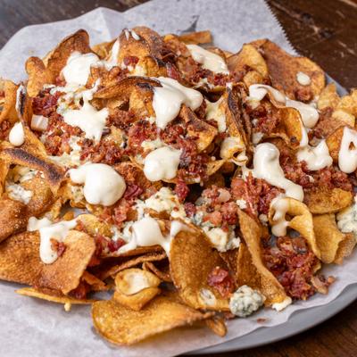 Nachos served on the plate.