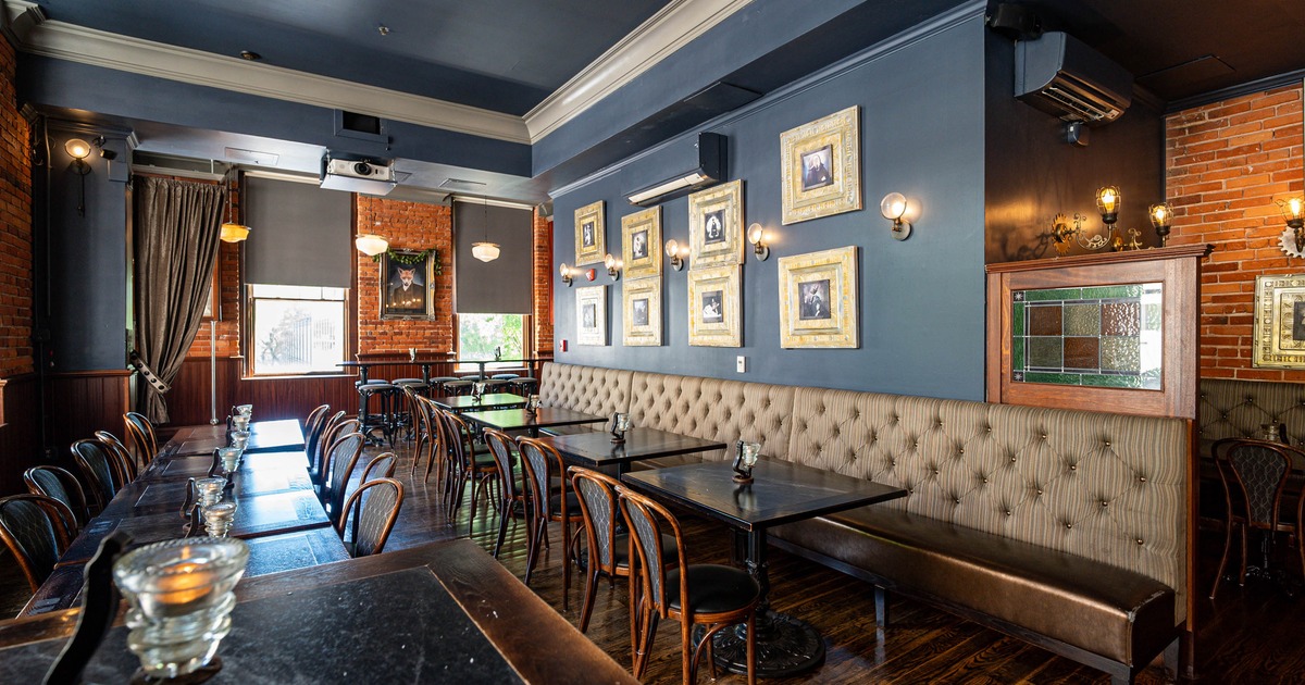 Interior, tables and chairs with pictures on the wall
