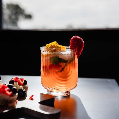 Wine cocktail in a cute glass with fresh fruit.