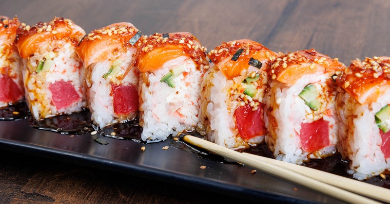 Tuna and crab meat rolls, topped with salmon