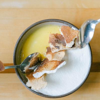 Lemon Panna Cotta dessert with vanilla whipped cream and toasted meringue at Table Asheville..