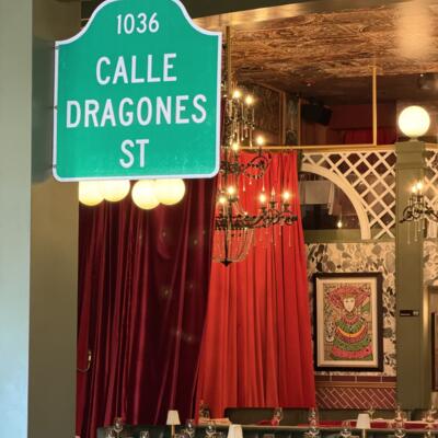 A sign with the name of calle dragones.