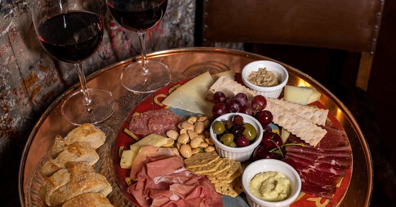 Platter with meats, cheese, crackers and olives