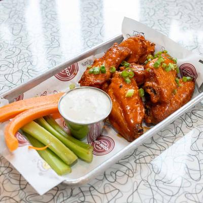 Buffalo Wings, with carrots, celery, and dip.