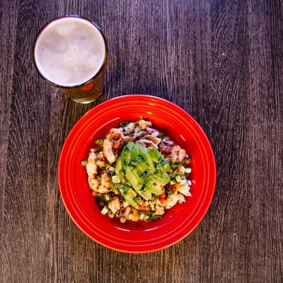Shrimp ceviche, top view, and a beer.