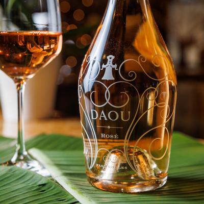 Daou rose wine bottle with wine glass on side