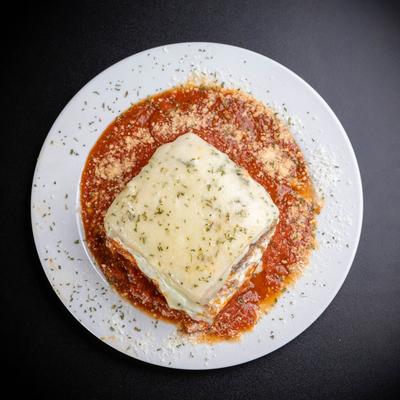 Lasagna, in tomato sauce, smothered in cheese.