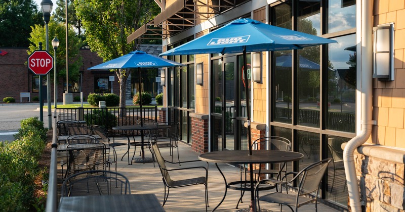 Exterior seating area with chairs and tables