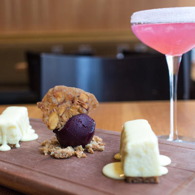 Lemon cheesecake with cracker base, oat crumble, almonds, blueberry sorbet