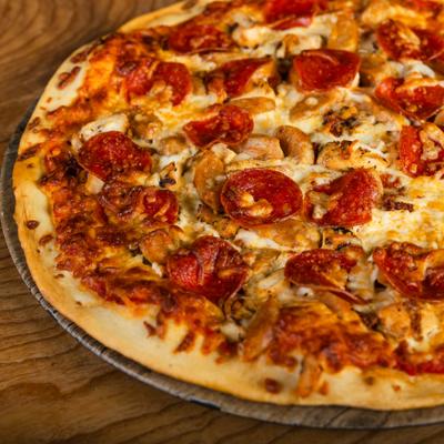 Meat lovers pizza, served, top view.