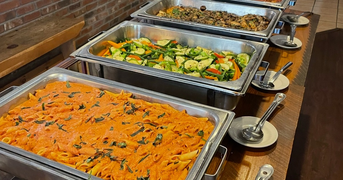 Catering event w/ Rigatoni Pasta, Vegetable medley.