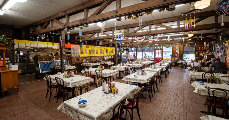 Spacious interior dining area with set tables ready for guests
