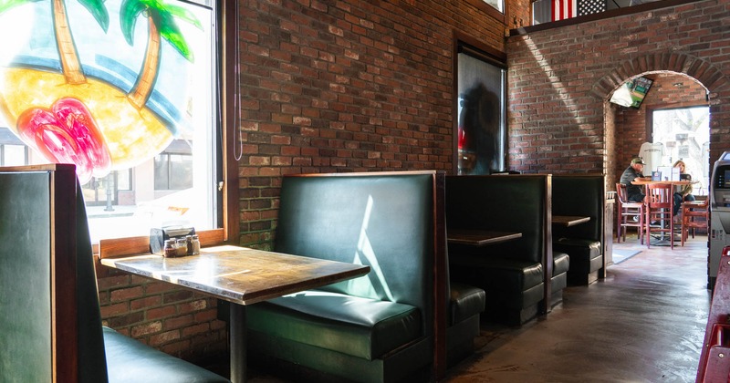 Interior, booths with tables near the windows