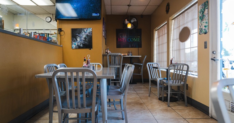 Interior, tables and chairs ready for guests