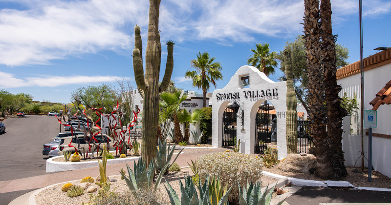Exterior, front gate, trees and cacti