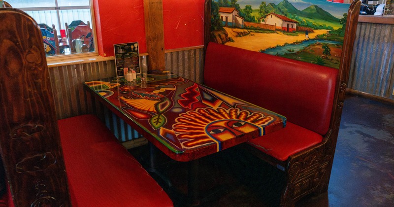 Interior, seating booth and colorful painted table