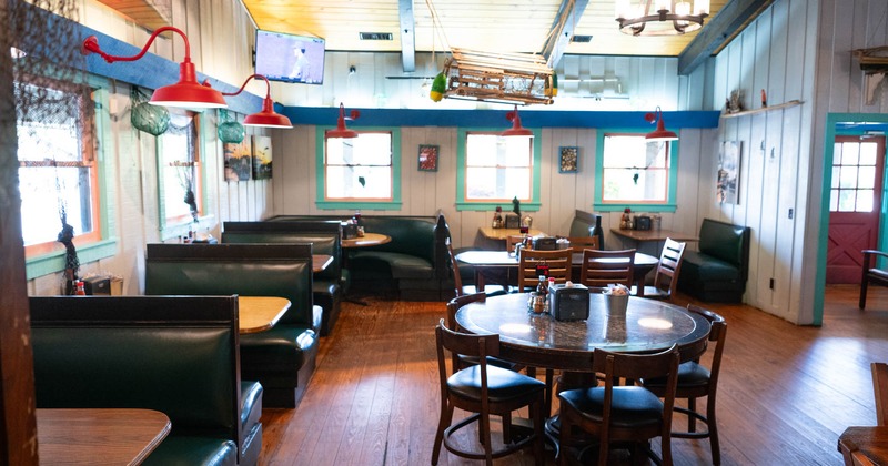 Interior, seating area with boots, tables and chairs