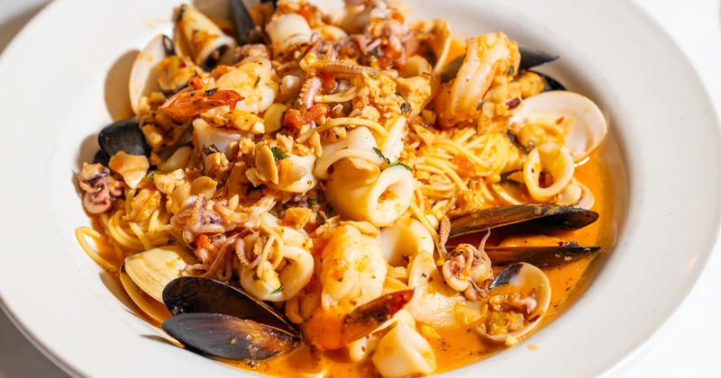 Clams, calamari, mussels, and shrimp pasta in a light marinara