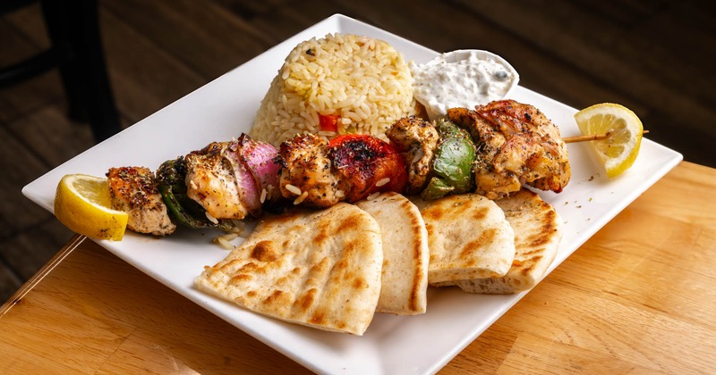 Chicken Souvlaki with pita bread, rice, and tzatziki
