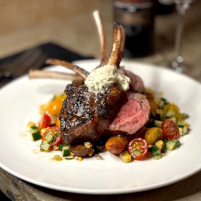 Lamb chops over vegetables.