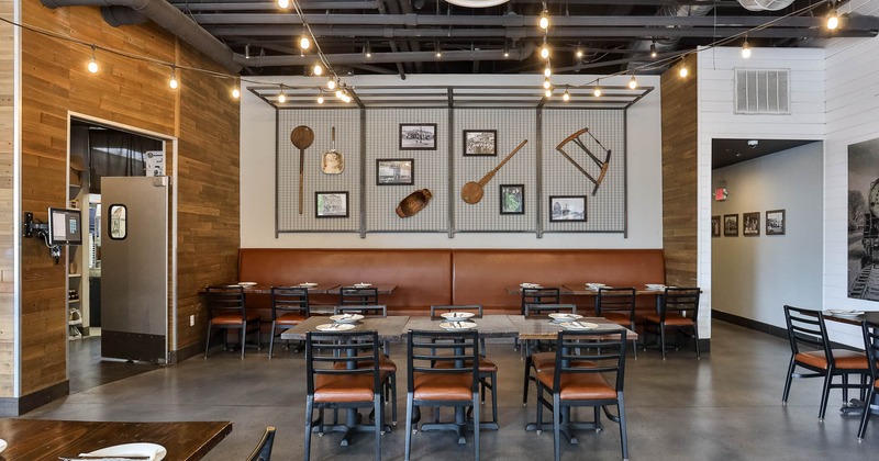 Interior, decoration on the wall behind tables and chairs in seating area
