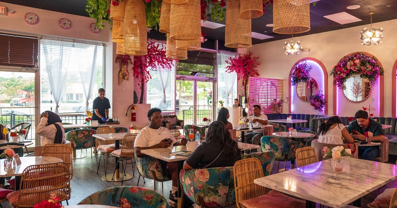 Lively and cozy restaurant interior, dining area full of guests