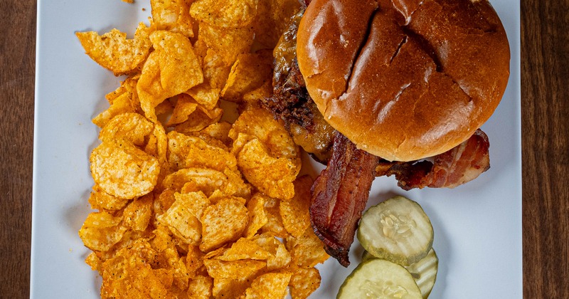 Western burger with a side of chips