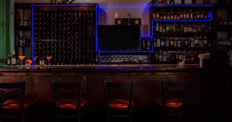 Bar area, bar stools lined up