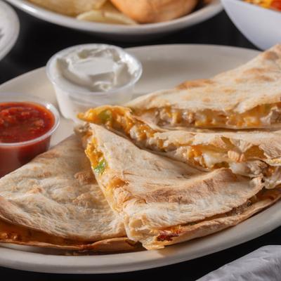 Chicken Quesadillas, with sour cream and marinara sauce.