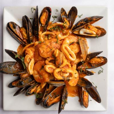 Linguine pasta with mixed seafood and marinara sauce.