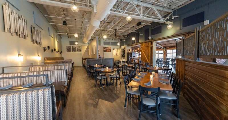 Interior, dining area, seating booths on the left, tables with chairs on the right