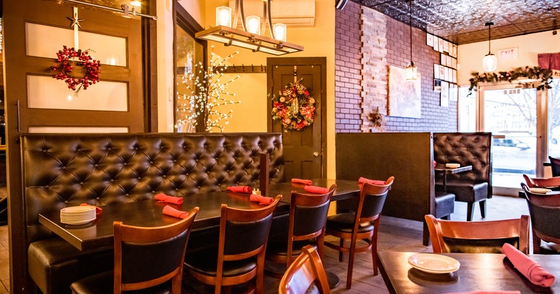 Modern and cozy interior dining area with set tables