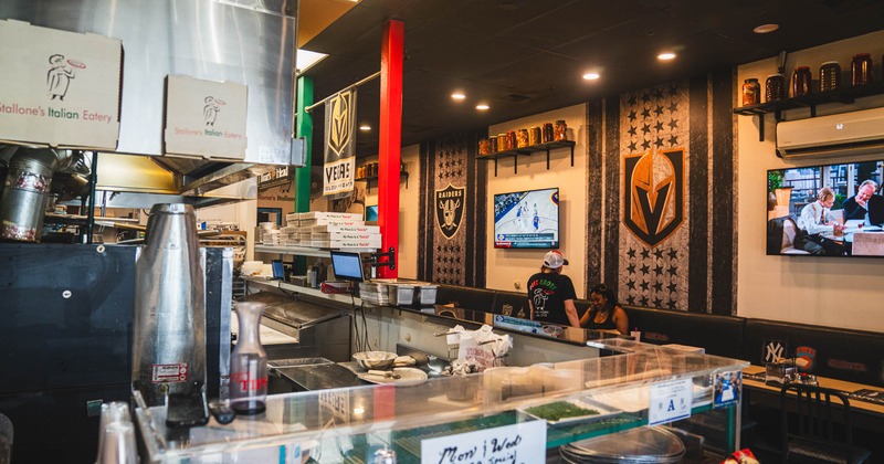 Food counter, tables and chairs behind