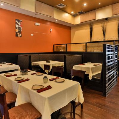 Booths and tables set for dining.