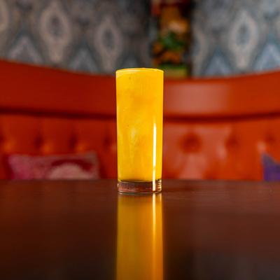Mango lassi on a table.